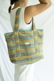 Model carrying the handmade hemp tote bag, ideal for daily use