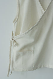 Close-up of side seam and waist tie of hemp cotton wrap top, shows clean stitching and texture of eco-friendly material