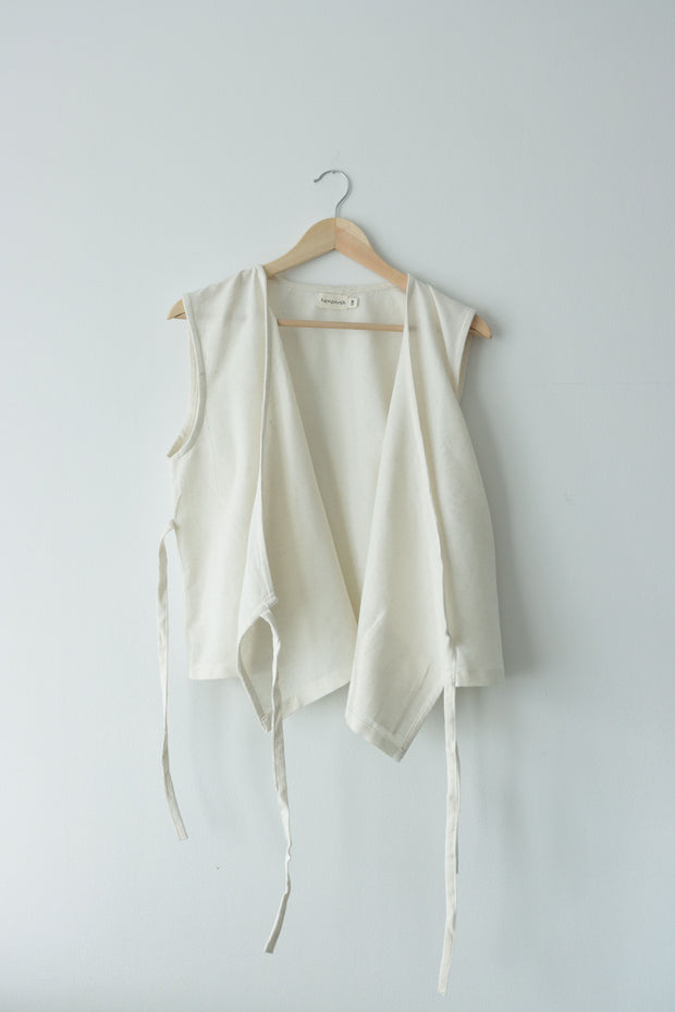 Open view of handmade hemp and cotton wrap vest, airy and natural, ideal for sustainable lifestyle wardrobes