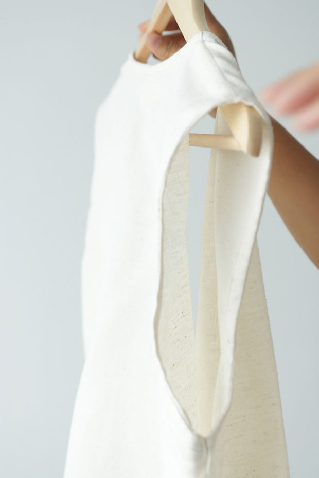 Hemp-cotton sleeveless wrap top held up to show soft, breathable weave, sustainable and handmade summer clothing for women