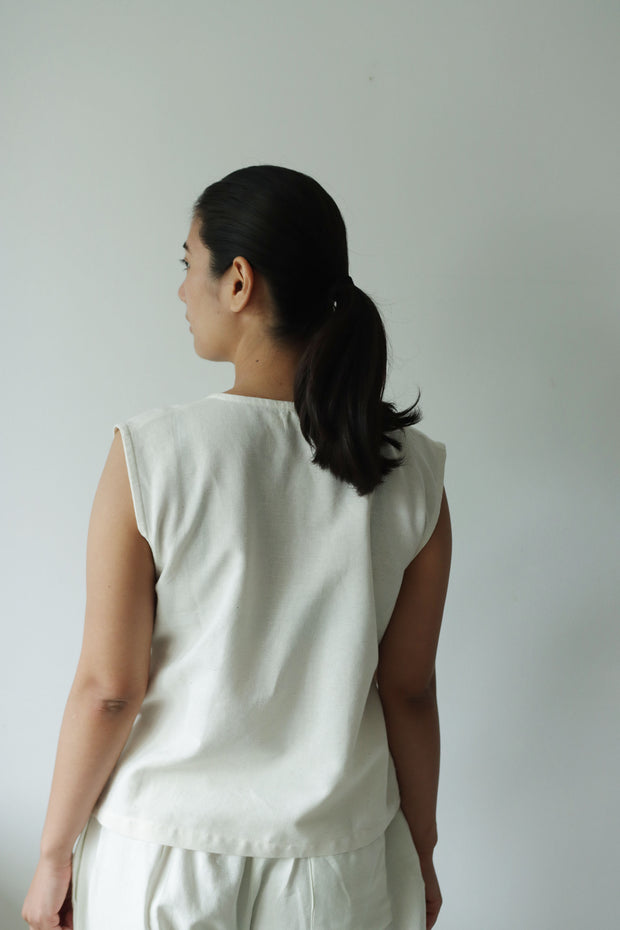 Back view of a hemp cotton wrap vest showing its relaxed fit and breathable design, ideal for minimalist summer fashion