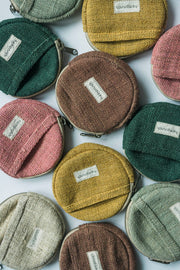 Collection of eco friendly Coin Purses in various colors—Blue, Stripes, and Brown—arranged to showcase the available options