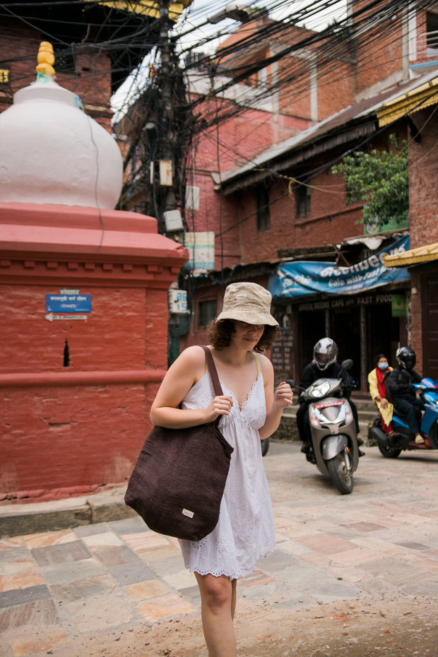 A girl carries a large Hemp tote in brown colour