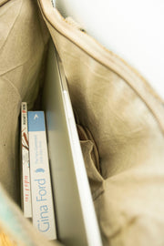 Interior view of the large tote with compartments, showing how books and essentials fit easily