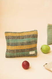 Two-tone hemp pouch with organic texture placed beside fresh produce
