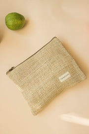 Natural beige hemp pouch shown with lime on soft background