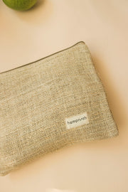 Hemp pouch bag with textured weave presented on a warm neutral surface