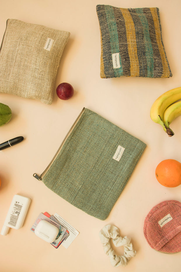 Eco-friendly toiletry pouches displayed with fresh fruit and daily essentials