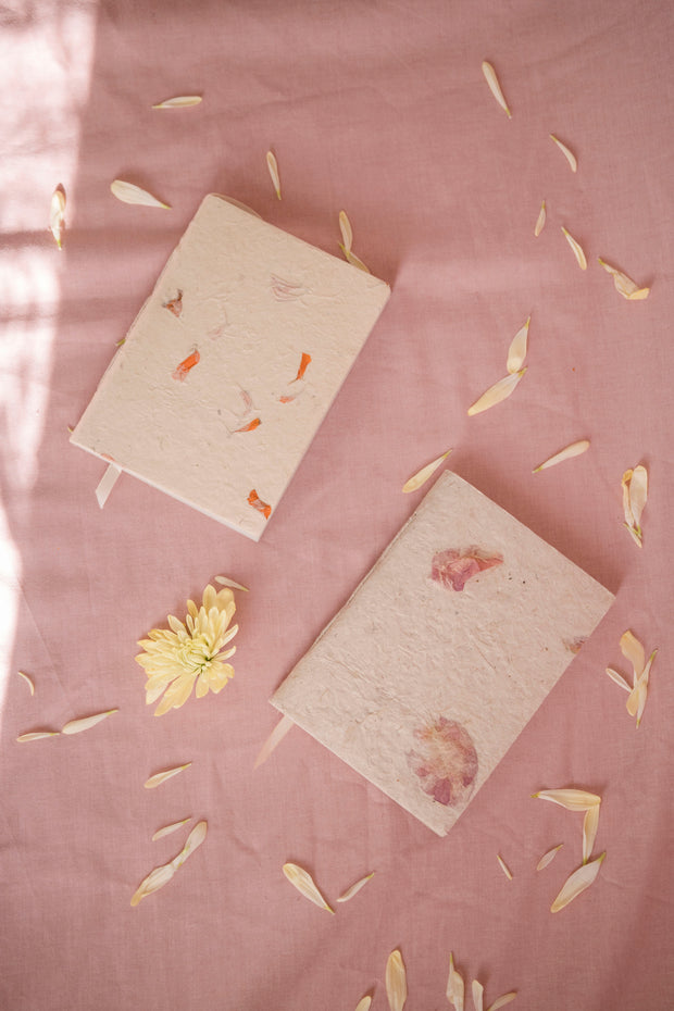 Handcrafted A6 notebook with a cover adorned with pressed Bougainvillea and Marigold petals