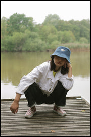 Eco-friendly hemp bucket hat in blue, perfect for sun protection and outdoor activities