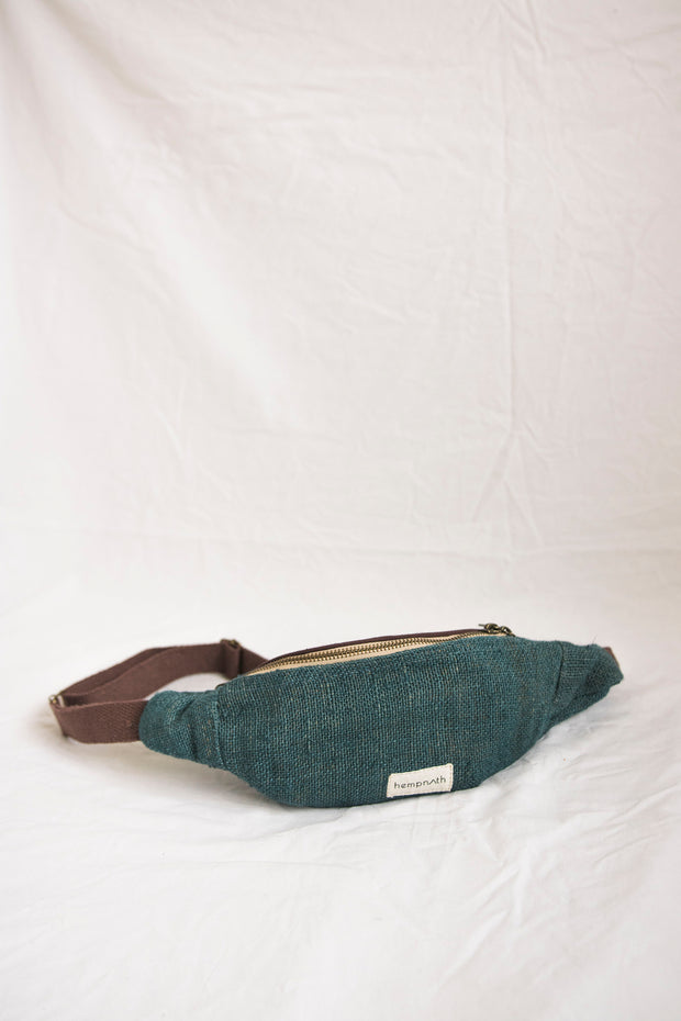 A sleek dark blue hemp waist bag with handcrafted detailing, ideal for travel and daily use.